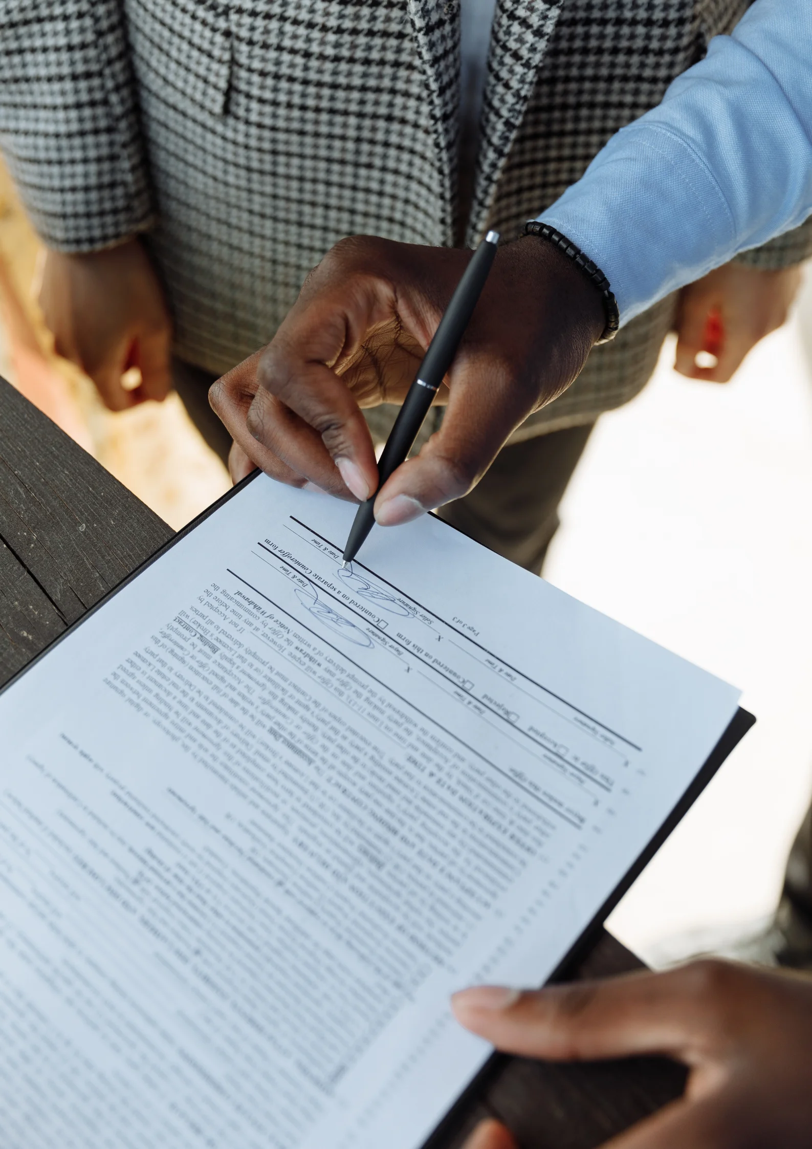 a person signing a document