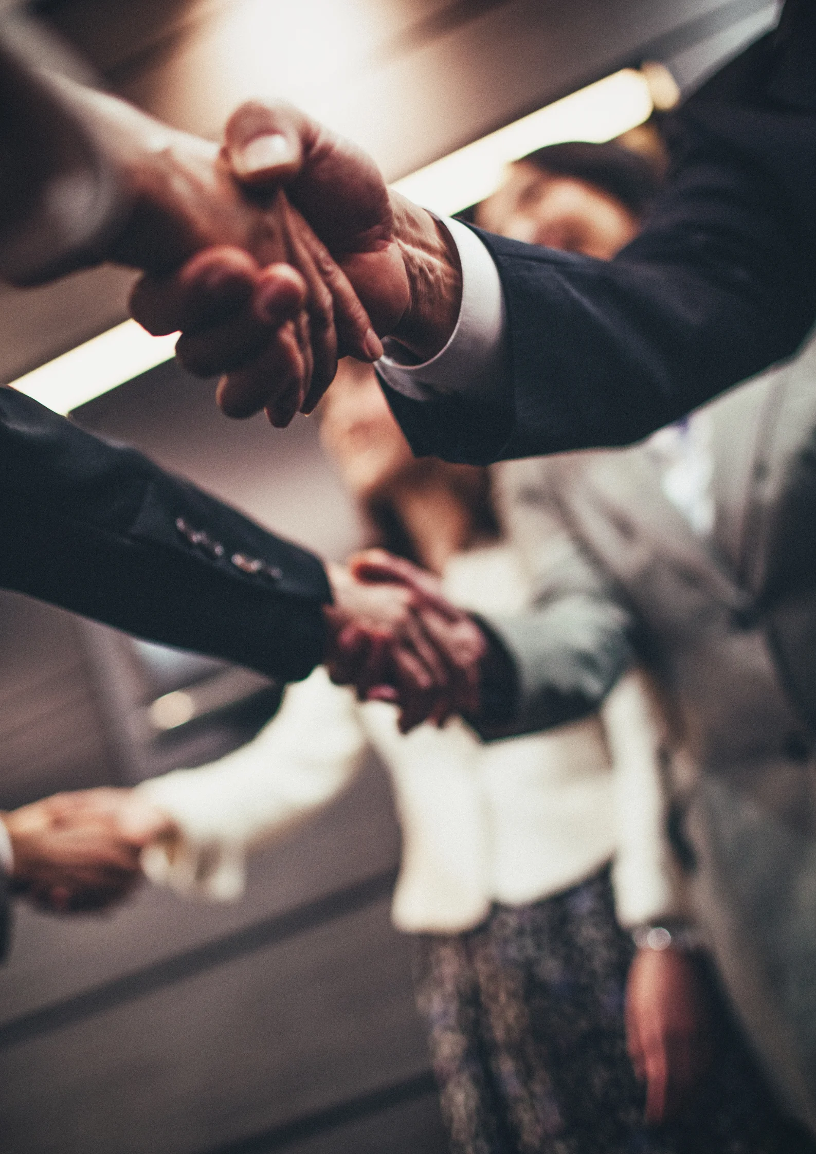 a close-up of people shaking hands