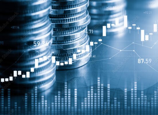 tacked coins and financial charts symbolizing BEE investment. Stacked coins and financial charts symbolizing BEE investment.