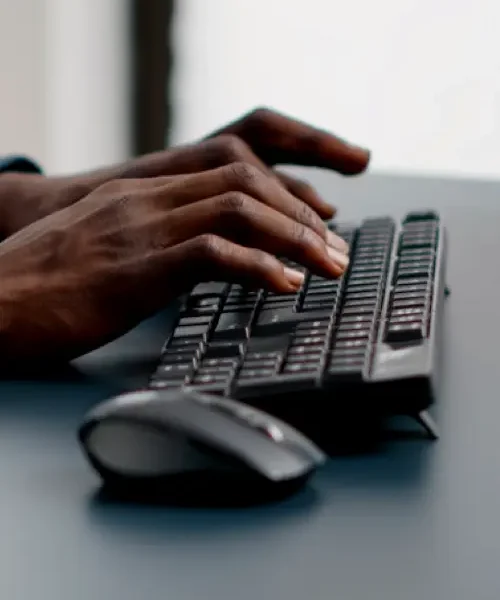 31-Image-500-X-835-qmctx0ae89kh9hkto8wjv63g6803mcpwjyy0xrxisw black business man working on a computer